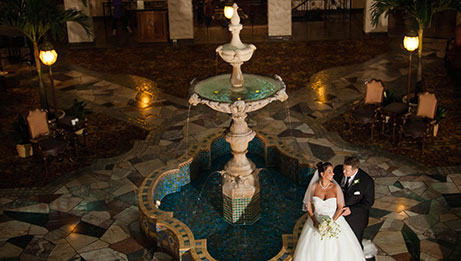 Bride and Groom in Fountain Lobby