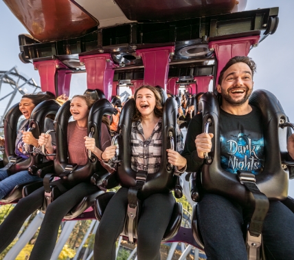 Group of people in dark nights apperal riding The Great Bear.